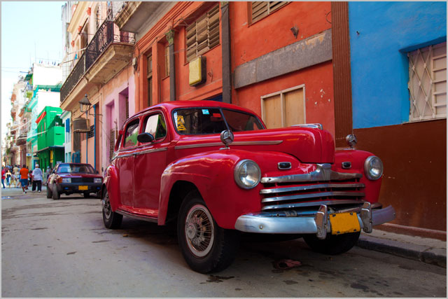 Vintage red car on the street of old city, Havana, Cuba